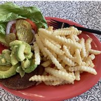 Beyond Burger with avocado, pickles, tomato, lettuce, onions and fries  at Universal Studios - Bayliner Diner in Orlando