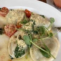 Kreplach dumplings with kale (2 of them already gone)  at Szklarnia Warszawa in Warsaw