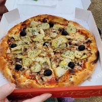 Medium vegan pizza with mushrooms, potato, olives and artichoke. at La Mia Pizza in Paris
