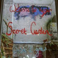 Outdoor seating area in non smoking garden at Nexus Art Cafe in Manchester