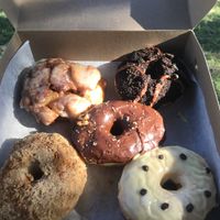 Apple (top left), Oreo (top right), Hazelnut/chocolate (middle), Cinnamon (bottom left), Passionfruit (bottom right) at La Beignerie in Montreal