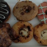 Boston cream, maple bacon, strawberry lime, apple fritter, crème brûlée at La Beignerie in Montreal