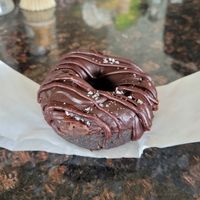 Double chocolate: chocolate cake donut, chocolate glaze, chocolate drizzle, and sea salt #Veganuary at Beacon Doughnuts in Chicago