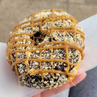 Caramel chocolate cookie: yeast donut, chocolate glaze, caramel drizzle, shortbread crumble. My favorite💗#Veganuary at Beacon Doughnuts in Chicago