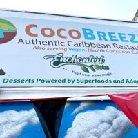Note the outdoor sign highlighting healthy vegan options at Coco Breeze in Oakland