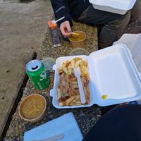 Battered sausage, chips and curry sauce at French's Fish Shop in Wells-next-the-sea
