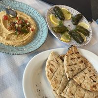 Hummus, vine leaves, and pita   at Meli & Thymari in Santorini