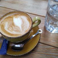 Cappuccino with oatmilk (cookie not vegan) at Zaytouna Cafe in Aachen