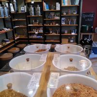 Bulk section of prepared vegan meals like lentil stew and zero waste school supplies in the back at Demain - L'épicerie in Spa