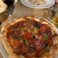 Greek Pizza without cheese (very delicious) at Fanalino Restaurant Bar in Paxos