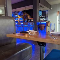 Bar and table atmosphere at TIQA in Portland