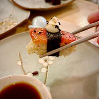 Tomagiri: nigiri with marinated plum tomato with seaweed, Tamari sauce and sesame seeds, topped with cashew nut cream cheese and spicy vegan mayo at Veganashi - Gluten Free Sushi in Barcelona