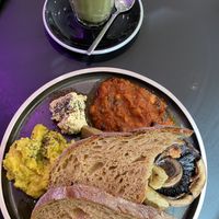 Matcha latte and vegan plant dish at 17 Grams in Brighton