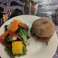 Fried chickun sandwich with a side of steamed veggies at Salud Para Vida in San Pedro La Laguna