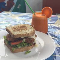 chicken sandwich and fresh carrot juice!  at Salud Para Vida in San Pedro La Laguna