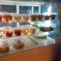 Salads and mezze display at C'est Bon Salades Maison in Marseille