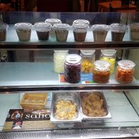 Desserts and ingredients display at C'est Bon Salades Maison in Marseille