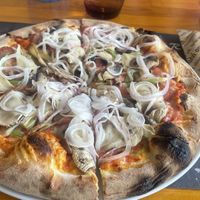 This is a large vegetarian, switched to vegan cheese. It was about 12€. The ingredients and base were delicious!   at Porto Rino in Crete