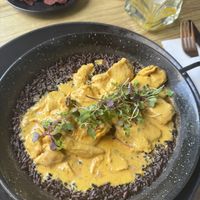 Chicken with black rice   at Street & Soul in Toledo