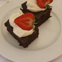 Chocolate brownie with strawberries and coconut cream at Mala in Leipzig