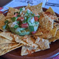 Guac with nachos at The World Family in Finisterre