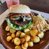 Burger with fries and coleslaw   at The World Family in Finisterre