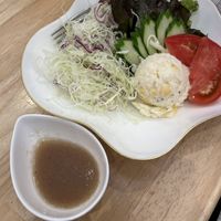 Salad with onion dressing  at KOMEDA is in Tokyo