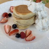 Pancakes with berries and whipped cream   at KOMEDA is in Tokyo