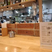 Tables facing the kitchen at KOMEDA is in Tokyo