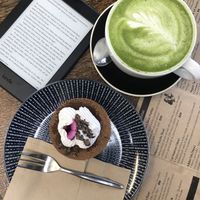 Matcha green latte and delicious cake at Wise Cicada Wholefood Cafe in Auckland