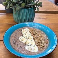 Hazelnut milk bowl with cacao, dates, homemade peanut butter, banana, granola and chia seeds at Cafe Noti in Mallorca