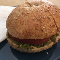Bagel with vegan pesto and tomato at Malabarista Cafe in Lisbon