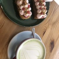 Vegan Pistachio Framboise cake and matcha latte   at Malabarista Cafe in Lisbon