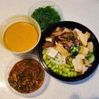 Clockwise from top: seaweed salad, build-a-bowl, kimchi jalapeños, coconut curry broth at Mainely Noods in Portland