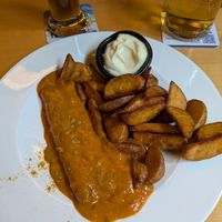 2 vegan sausages underneath the fruity (spicy) curry sauce at Roter Hof in Flensburg