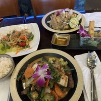 Hug Rama with mock duck, spring rolls, pineapple rice with tofu, and papaya salad  at Hug Thai Cuisine in Bellmore