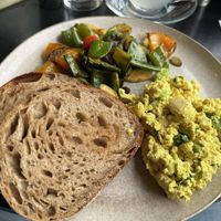 Scrambled tofu with grilled vegetables and sourdough bread  at KLYO in Vienna