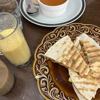 Pumpkin soup, quesadilla, ice Vietnamese coffee (with vegan condensed milk) and a sunshine smoothie.  at Abracado in Hanoi