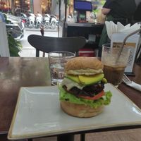 Black bean burger and coffee with condensed milk and oatmilk at Abracado in Hanoi