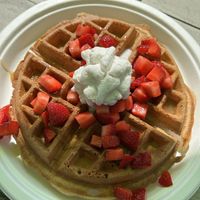Waffle w/strawberries, caramel sauce, whipped cream  at Sweet Izzy in Harwich Port