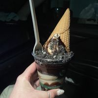 Chocolate and vanilla soft serve twist with “Oreo”s, hot fudge, and a waffle cone. Yummmm  at Sweet Izzy in Harwich Port