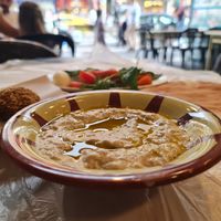 Mutabal, stuffed falafel, and the complimentary mint/tomatoes/pickles/onion. at Hashem in Amman