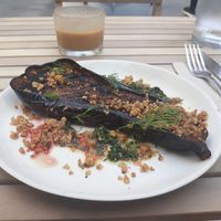 Sage-smoked aubergine with salsa verde, coconut crumble & hibiscus at Chéri Coco in Pantin