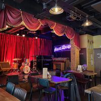 Stage for concerts. Check their event schedule    at The Sound Lounge in Sutton