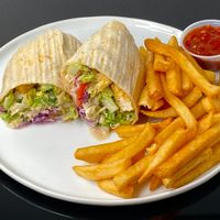 garlic tofu wrap w/dreamy tahini + fries w/spicy chili (cut in half + plated at home) at Doner Box in Seattle