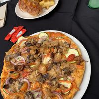 ‘Chicken’ and ‘chorizo’ pizza with seasonal veggies (massive portion)❤️ at Phoenix Belgian Vegg in Malaga