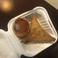 Samosa and spicy sauce. They went well together.  at Tigi's in Stone Mountain