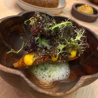 Charred sweet potato with kohlrabi, salsa macha, and mustard frills.  at Oyster Oyster in Washington