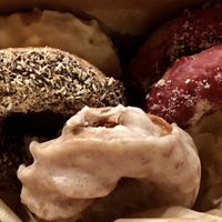 Vegan doughnuts: orange creamcicle, blueberry cream cheeze, chocolate coconut, and vanilla something. All insane. at Babes in Sacramento