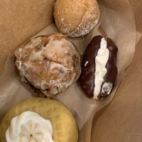From bottom: lemon meringue, apple fritter, eclair, Nutella donut hole.   at Babes in Sacramento